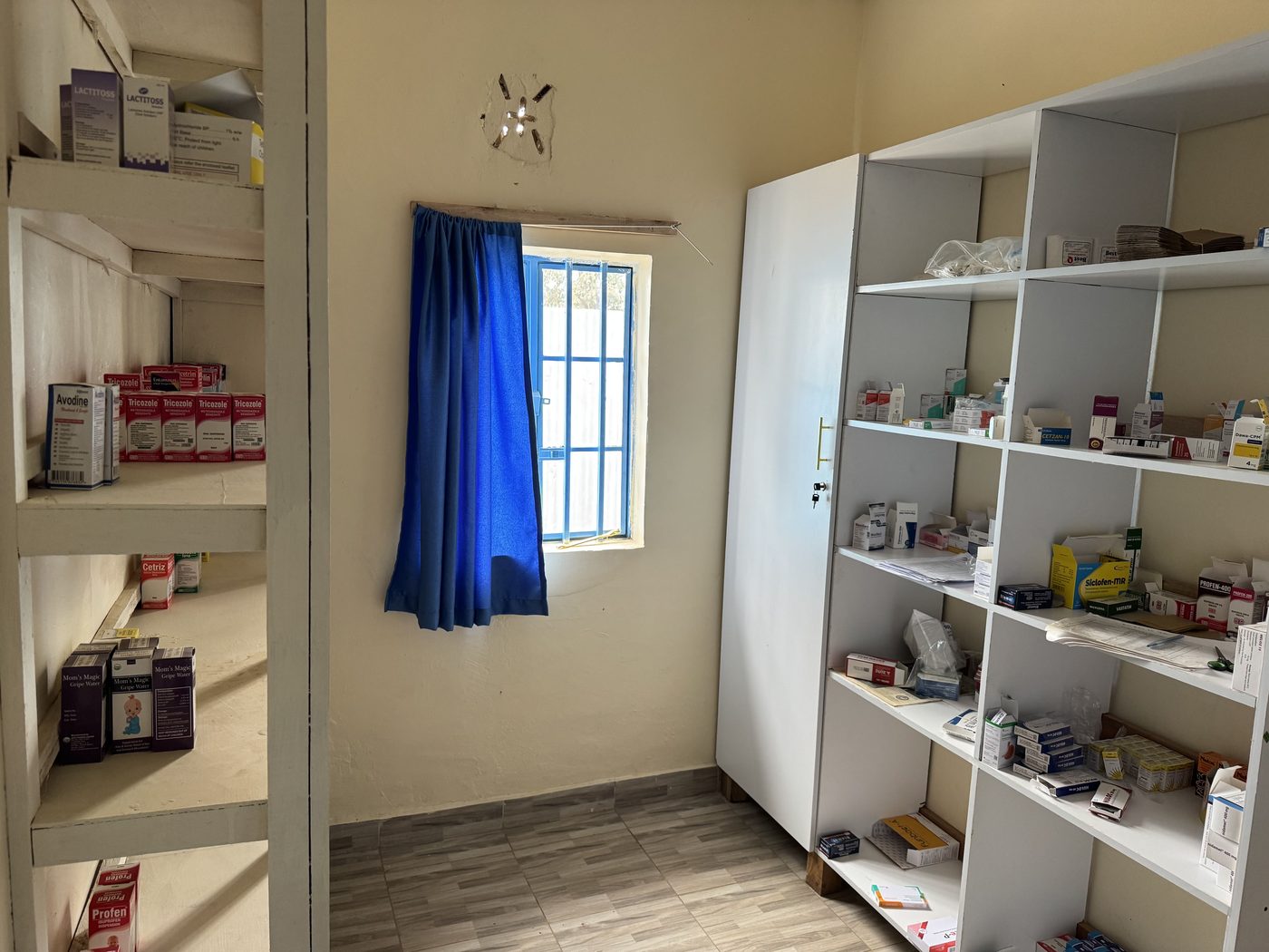 The pharmacy shelves of the Afya Care Centre