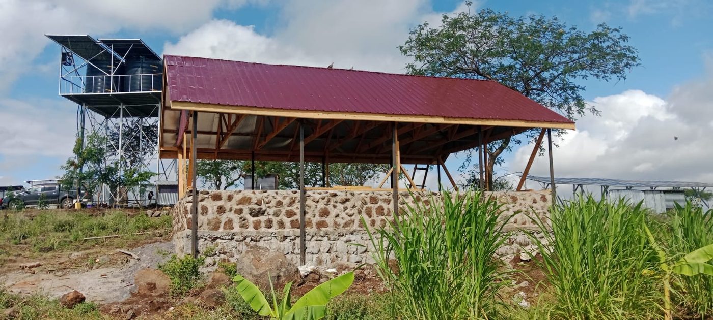 The first building of the Isineti Project, with the water tank behind