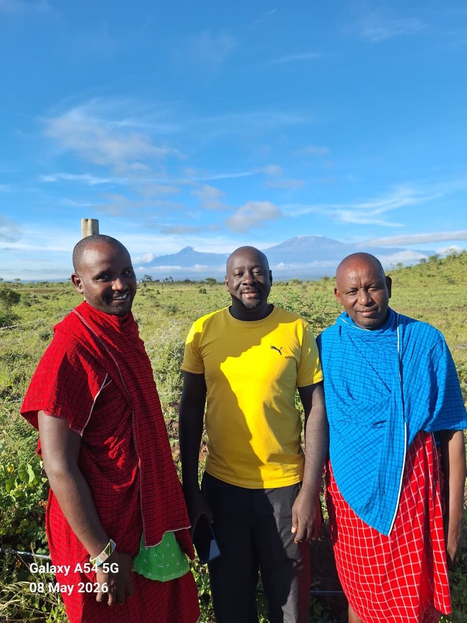 Three men on the land at Isineti