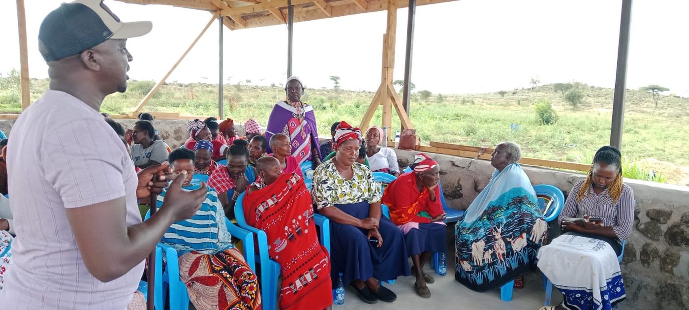 An instructor addressing the group at Isineti