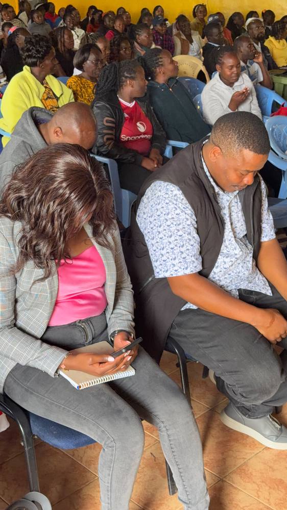 Participants follow the proceedings during the graduation ceremony