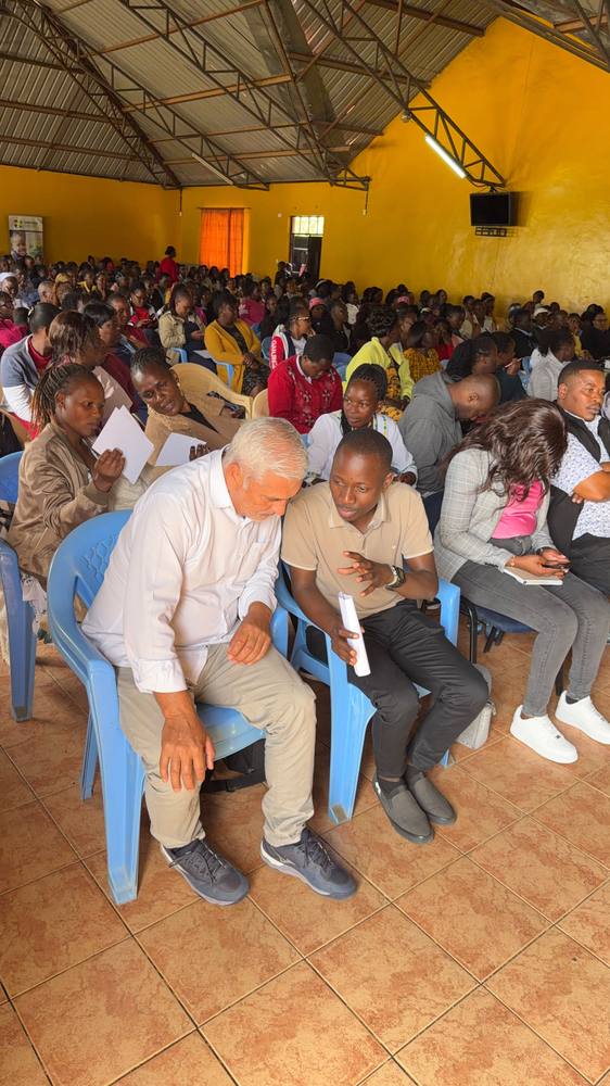 Guests confer during the graduation ceremony at OCTC Kandisi