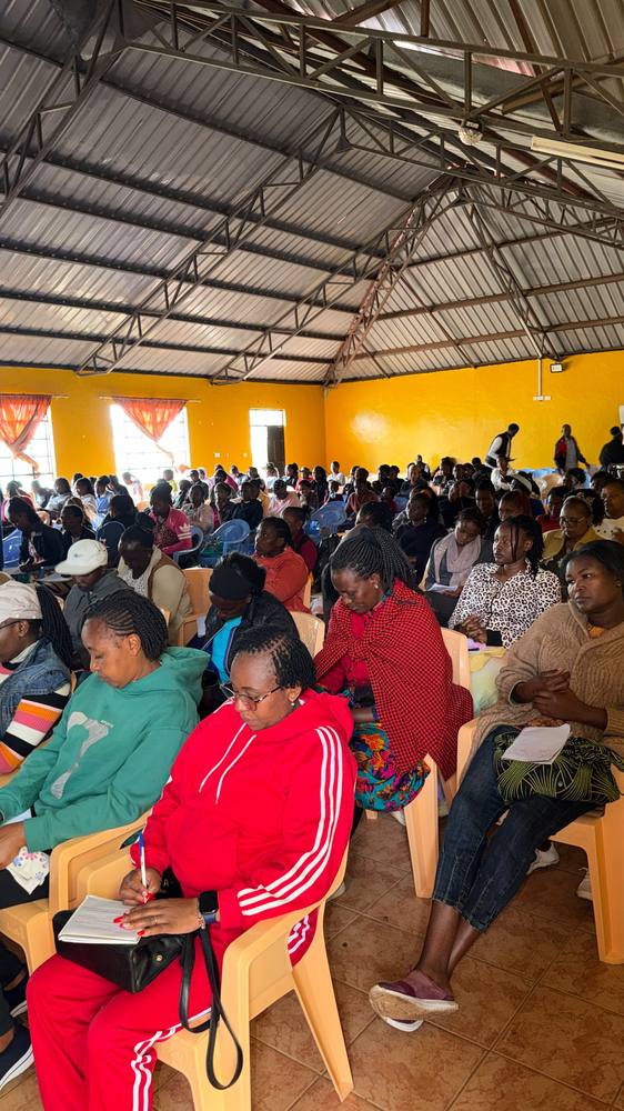 Participants take notes during the training session