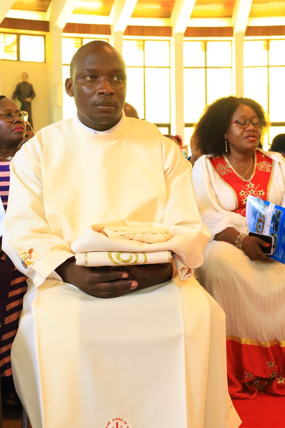 Deacon Justus Nyabuga Barongo seated during the ordination Mass