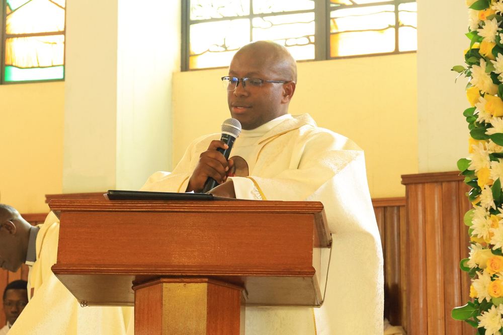 A priest addresses the congregation at the lectern